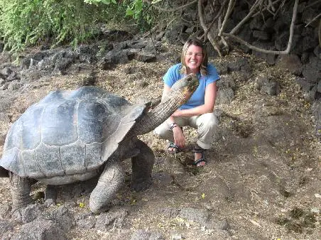 The Galapagos Tortoise next to a woman