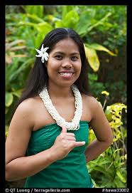A Tahitian woman with a hibiscus flower tucked behind her ear